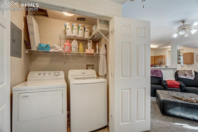 washroom featuring electric panel, ceiling fan, washing machine and clothes dryer, and carpet