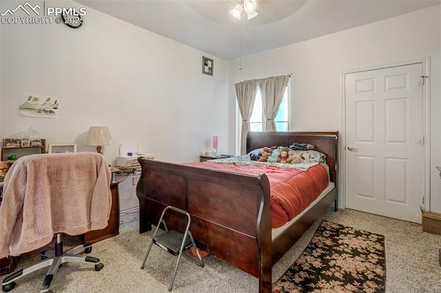 bedroom featuring ceiling fan and light colored carpet