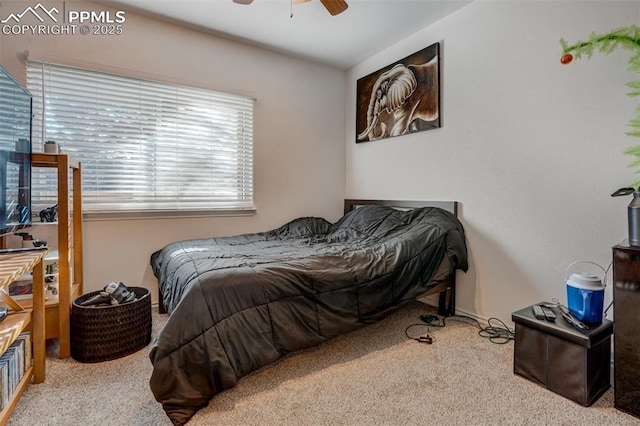 bedroom with light carpet and ceiling fan