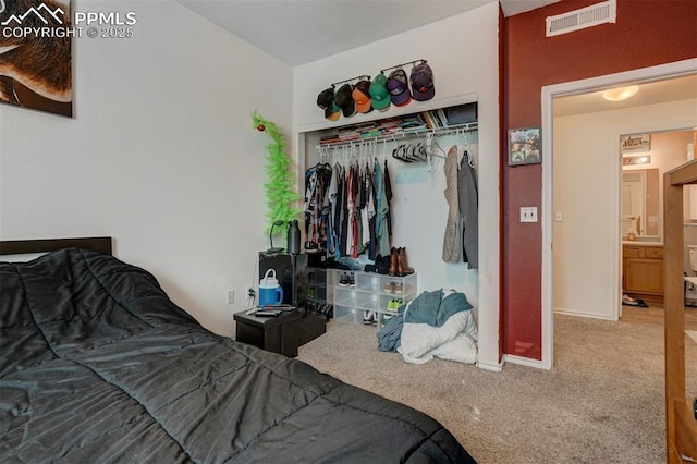 carpeted bedroom with a closet