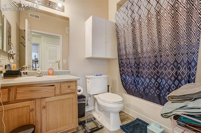 full bathroom with toilet, tile patterned floors, shower / tub combo with curtain, and vanity