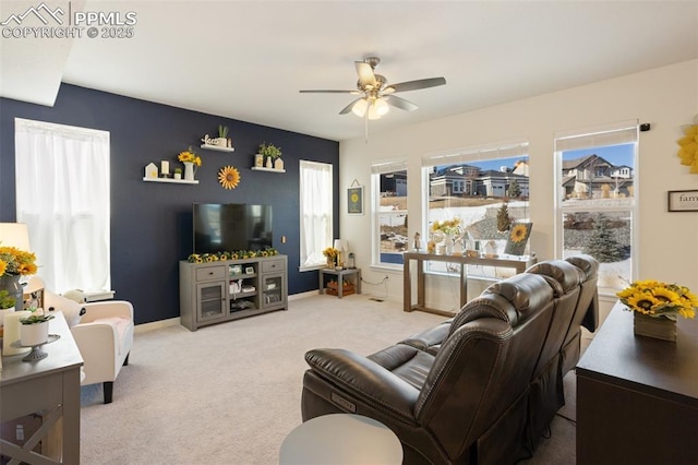 living room with ceiling fan and carpet