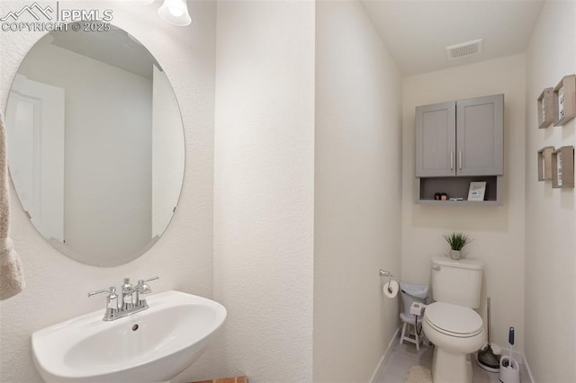 bathroom with toilet and sink