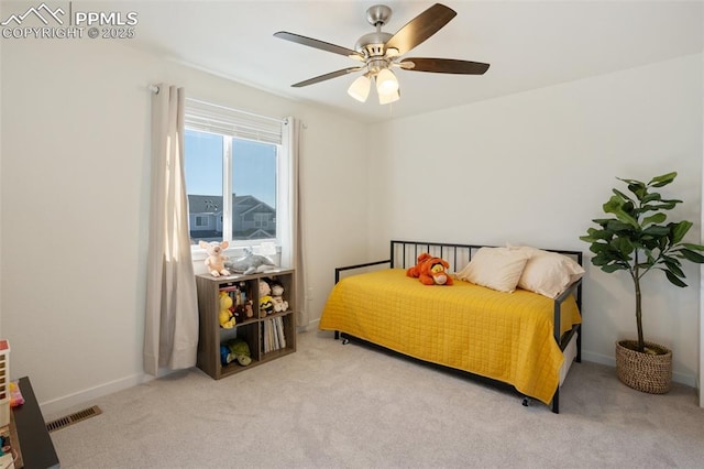 bedroom with ceiling fan and light colored carpet