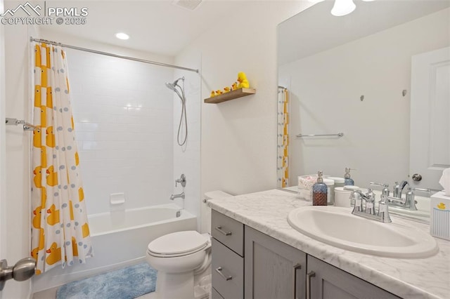 full bathroom with toilet, vanity, and shower / bath combo with shower curtain