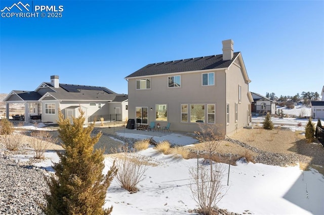 view of snow covered property