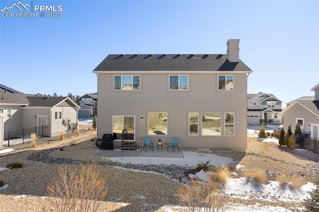 back of property featuring a patio area