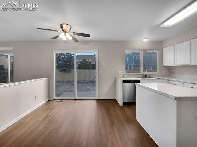 kitchen with dishwasher, white cabinets, sink, ceiling fan, and dark hardwood / wood-style floors