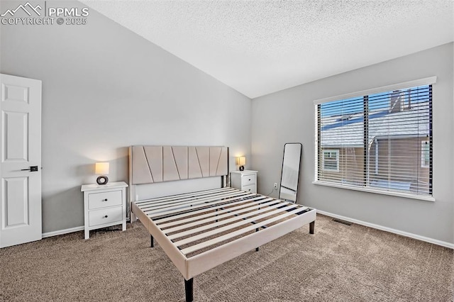 bedroom featuring light colored carpet, a textured ceiling, and vaulted ceiling