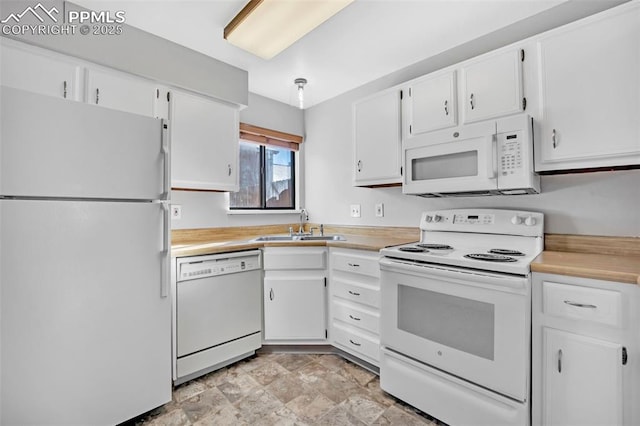 kitchen with white cabinetry, sink, and white appliances