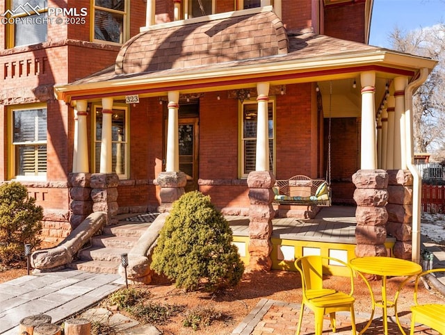 property entrance featuring covered porch