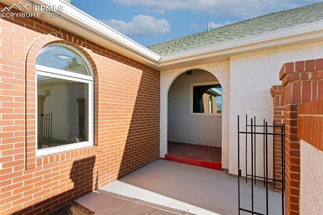 doorway to property featuring a patio area