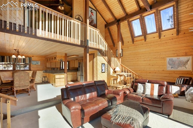 carpeted living room featuring wood ceiling, high vaulted ceiling, and wood walls