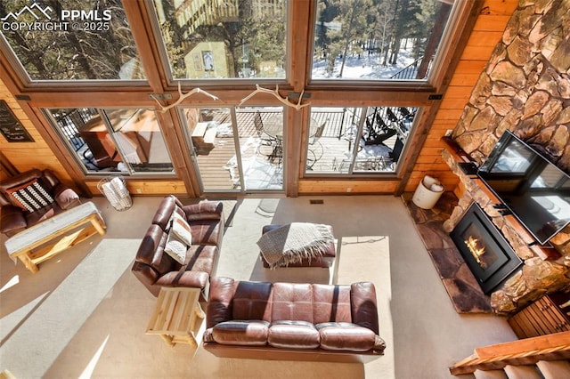 sunroom / solarium featuring a fireplace