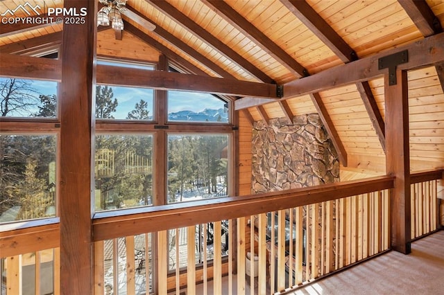 unfurnished sunroom featuring lofted ceiling with beams and wood ceiling