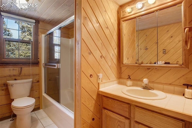 full bathroom with wooden walls, shower / bath combination with glass door, toilet, tile patterned floors, and wood ceiling