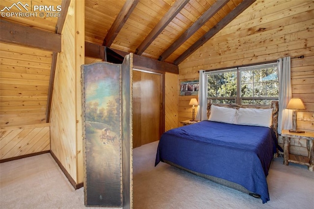 carpeted bedroom featuring wooden walls, vaulted ceiling with beams, and wood ceiling