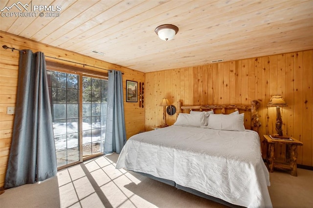 bedroom featuring wooden walls, access to exterior, light carpet, and wooden ceiling