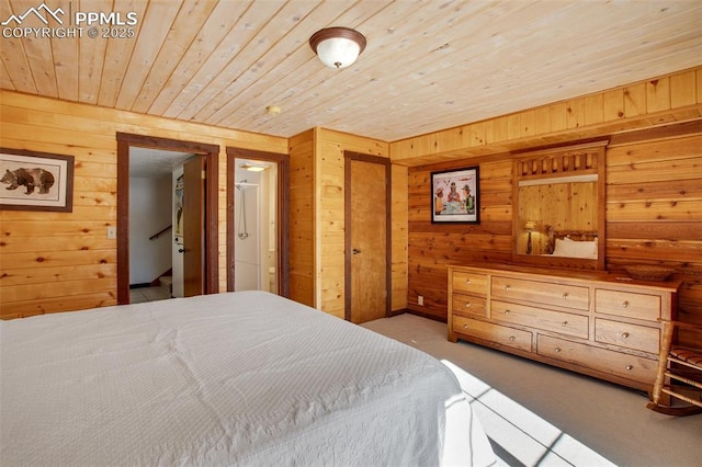 carpeted bedroom with wooden walls and wood ceiling