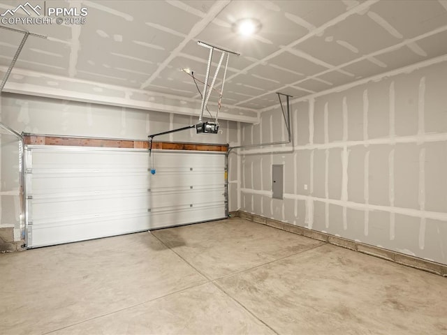 garage featuring a garage door opener and electric panel