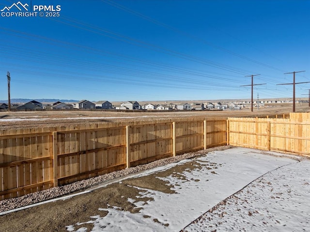 view of yard covered in snow