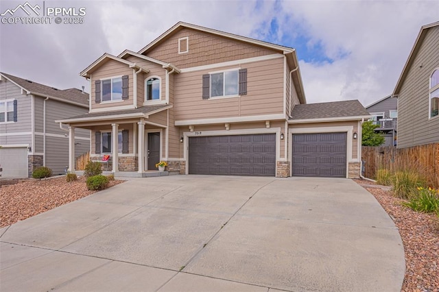 craftsman inspired home with a garage and covered porch