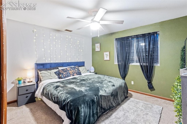 bedroom with ceiling fan and light colored carpet