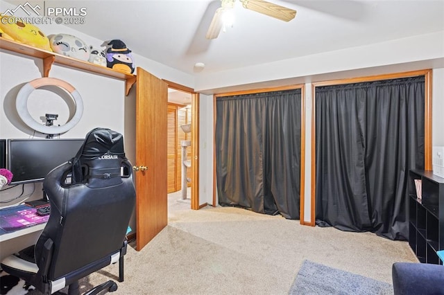 home office featuring carpet flooring and ceiling fan