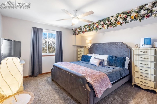 bedroom featuring ceiling fan and carpet