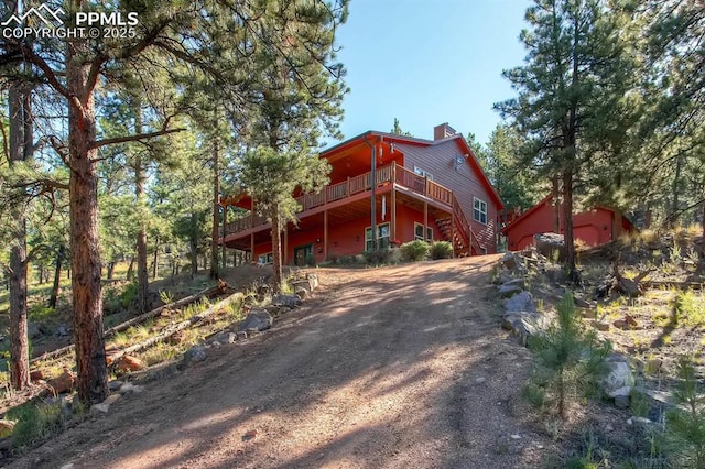 exterior space with a wooden deck and a garage