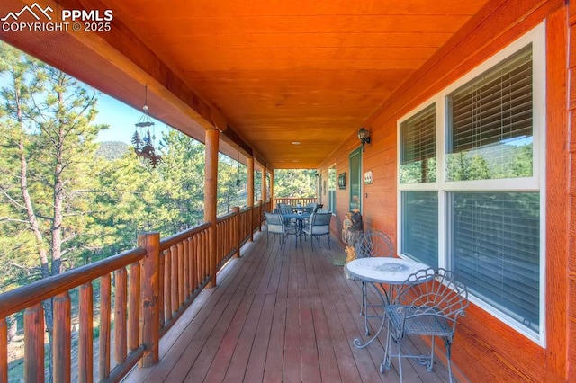 wooden deck featuring covered porch