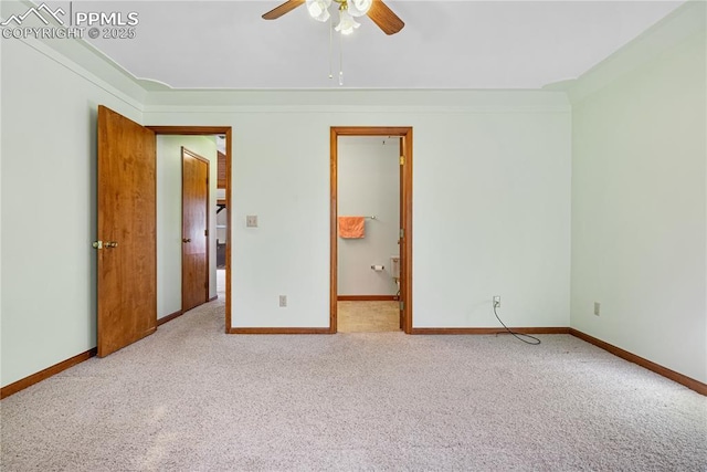 spare room with light carpet and ceiling fan