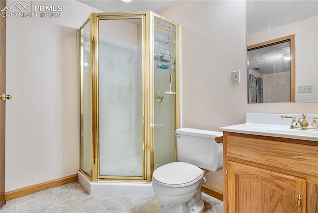 bathroom featuring a shower with shower door, toilet, and vanity