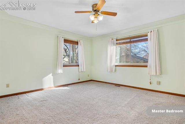 unfurnished room with carpet floors and ceiling fan