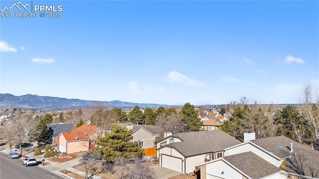 birds eye view of property featuring a mountain view