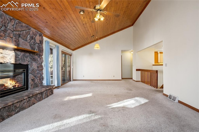 unfurnished living room featuring wood ceiling, a fireplace, carpet floors, and high vaulted ceiling