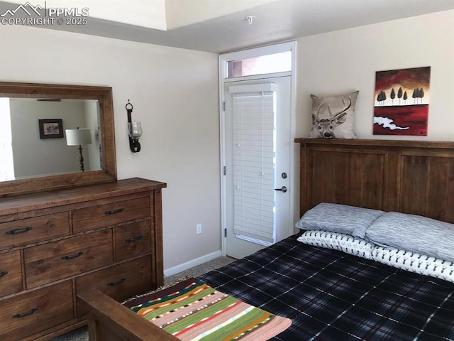 carpeted bedroom with ensuite bath