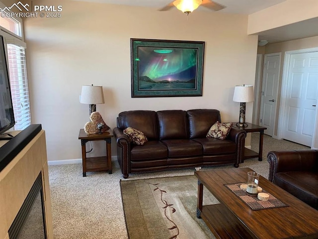 living room featuring ceiling fan and carpet flooring