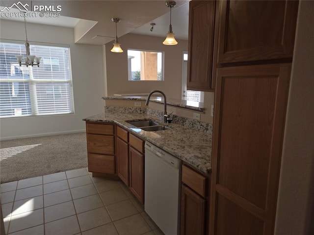 kitchen featuring sink, hanging light fixtures, a notable chandelier, white dishwasher, and light tile patterned floors