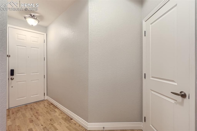 doorway with light hardwood / wood-style floors