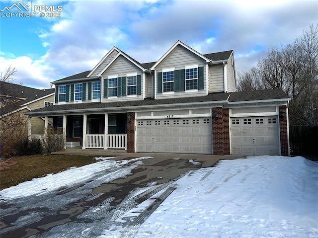 view of front of house with a garage and covered porch