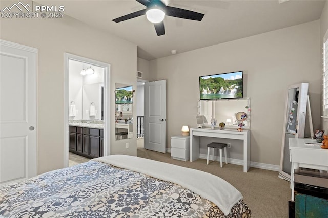 carpeted bedroom with ceiling fan and connected bathroom