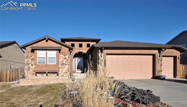 view of front of home featuring a garage and a front lawn