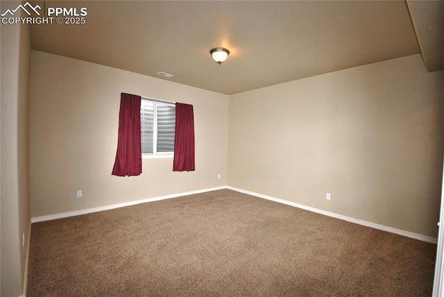 spare room featuring carpet floors