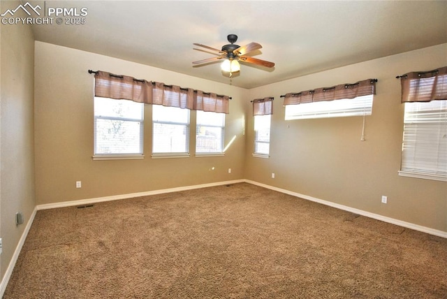 carpeted empty room featuring ceiling fan