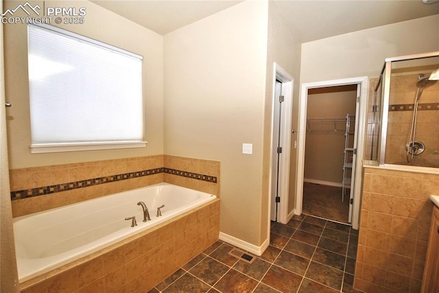 bathroom featuring separate shower and tub and vanity