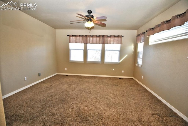 spare room featuring carpet floors and ceiling fan