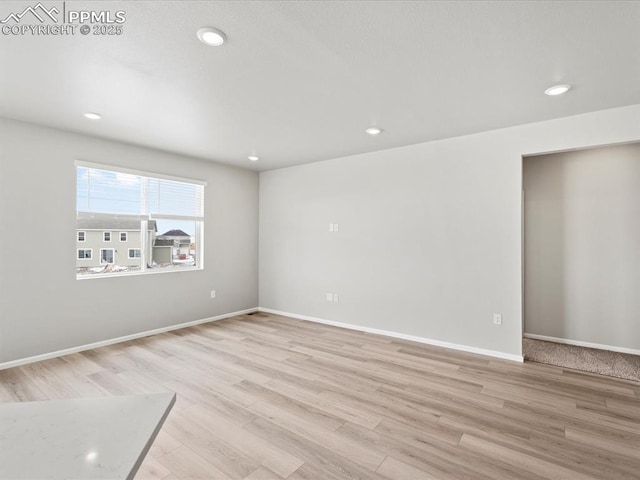 10434 Devoncove Dr, Peyton, CO 80831 - unfurnished room featuring light wood-style flooring, recessed lighting, and baseboards