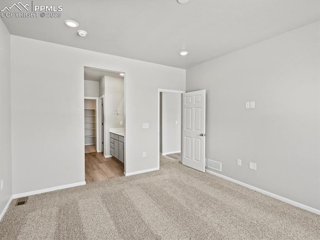 10434 Devoncove Dr, Peyton, CO 80831 - unfurnished bedroom featuring recessed lighting, light colored carpet, visible vents, and baseboards