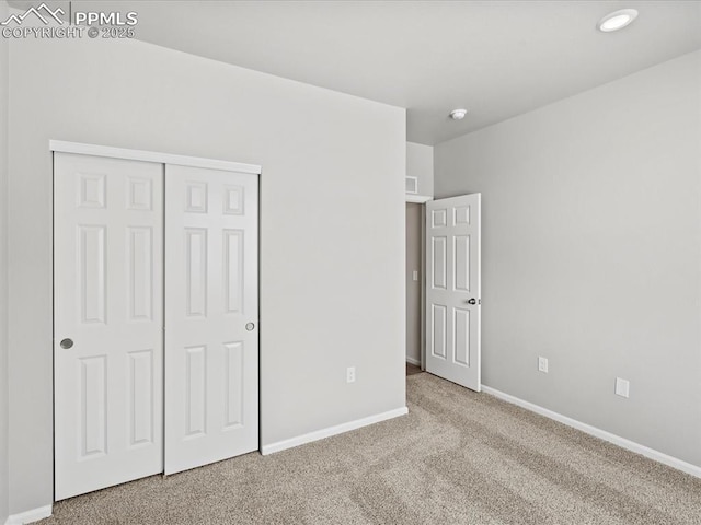 10434 Devoncove Dr, Peyton, CO 80831 - unfurnished bedroom with carpet flooring, visible vents, baseboards, and a closet